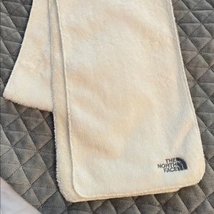 White fuzzy North Face scarf